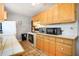 Bright kitchen with tile countertops, wooden cabinets, and modern appliances at 1255 North Nw Ave, Atlanta, GA 30318