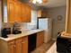 Well-lit kitchen with wood cabinets, tiled backsplash, and modern appliances, ideal for everyday cooking at 1255 North Nw Ave, Atlanta, GA 30318