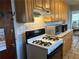 Charming kitchen features light wood cabinets and a gas range, perfect for preparing delicious meals at 1255 North Nw Ave, Atlanta, GA 30318