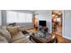 Cozy living room featuring hardwood floors, natural light, and a glimpse of the adjacent kitchen at 1255 North Nw Ave, Atlanta, GA 30318