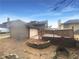 View of the backyard featuring a deck, stone border, and some mature trees at 4893 Hairston Pl, Stone Mountain, GA 30088