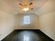Bedroom featuring hardwood floors and a window with natural light at 4893 Hairston Pl, Stone Mountain, GA 30088