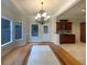 Dining room with hardwood floors, chandelier, and a view of the cabinetry at 4893 Hairston Pl, Stone Mountain, GA 30088