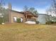 Inviting home with a charming front porch, stucco exterior, and well-maintained lawn at 4893 Hairston Pl, Stone Mountain, GA 30088