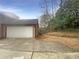 Spacious two-car garage with a paved driveway at 4893 Hairston Pl, Stone Mountain, GA 30088