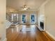 Living room featuring a fireplace, staircase, hardwood floors, and bright lighting at 4893 Hairston Pl, Stone Mountain, GA 30088