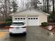 Two-car garage, featuring a white car at 2199 Sundown Ne Dr, Atlanta, GA 30345