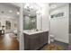 Well-lit bathroom with double sinks, a large mirror, and modern fixtures, providing comfort and convenience at 2261 Venetian Dr, Atlanta, GA 30311