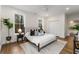 Relaxing bedroom with lots of light, neutral decor, and an ensuite bathroom featuring a free-standing tub at 2261 Venetian Dr, Atlanta, GA 30311