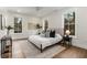 Bright bedroom features large windows, a ceiling fan, and neutral decor, creating a serene and comfortable space at 2261 Venetian Dr, Atlanta, GA 30311