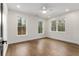 Bright, empty bedroom with hardwood floors and large windows providing ample natural light, creating a welcoming atmosphere at 2261 Venetian Dr, Atlanta, GA 30311