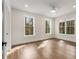 Spacious bedroom with hardwood floors, recessed lighting, ceiling fan, and three large windows at 2261 Venetian Dr, Atlanta, GA 30311