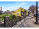 Charming yellow commercial building with outdoor seating, perfect for a restaurant or cafe at 2261 Venetian Dr, Atlanta, GA 30311