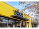 Bright yellow commercial building with inviting signage and modern lighting fixtures at 2261 Venetian Dr, Atlanta, GA 30311