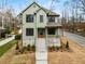 Charming two-story home with a welcoming front porch and professionally landscaped front yard at 2261 Venetian Dr, Atlanta, GA 30311