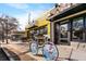 A quaint brick commercial building with unique outdoor seating area, featuring a decorative bicycle at 2261 Venetian Dr, Atlanta, GA 30311