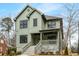 Beautiful two-story home featuring a covered porch and a well-manicured front yard at 2261 Venetian Dr, Atlanta, GA 30311