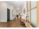 Bright foyer boasts hardwood floors, bench, and elegant front door at 2261 Venetian Dr, Atlanta, GA 30311