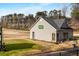 The golf course training building features a sign, outdoor seating, and shaded practice area at 2261 Venetian Dr, Atlanta, GA 30311