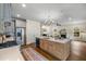 Well-lit kitchen with stainless steel appliances, a large island, and hardwood floors at 2261 Venetian Dr, Atlanta, GA 30311