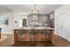 Spacious kitchen with a large island, stainless steel appliances, and ample storage at 2261 Venetian Dr, Atlanta, GA 30311