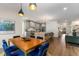 Open floor plan showcases kitchen, dining area, and living room with hardwood floors at 2261 Venetian Dr, Atlanta, GA 30311