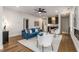 Cozy living room features a fireplace, bar area with cabinets, and hardwood floors at 2261 Venetian Dr, Atlanta, GA 30311