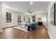 Spacious living room featuring a fireplace, hardwood floors and natural lighting at 2261 Venetian Dr, Atlanta, GA 30311