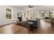 Sunlit living room featuring hardwood floors, fireplace, and open floor plan at 2261 Venetian Dr, Atlanta, GA 30311