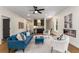 Inviting living room with a blue sofa, fireplace, and contemporary furnishings; perfect for relaxing and entertaining guests at 2261 Venetian Dr, Atlanta, GA 30311