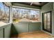 Covered porch with wood flooring and views of the neighborhood, offering a relaxing outdoor space at 2261 Venetian Dr, Atlanta, GA 30311