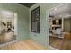 Green painted siding with a hardwood porch overlooking a bedroom and a living room and kitchen space at 2261 Venetian Dr, Atlanta, GA 30311