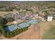 Aerial view of neighborhood amenities including tennis courts, pool, playground, parking lot and clubhouse at 410 Hickory Fairway Ct, Woodstock, GA 30188
