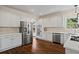 Bright eat-in kitchen featuring stainless steel appliances, and ample counter space at 410 Hickory Fairway Ct, Woodstock, GA 30188
