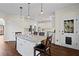 Stylish kitchen with island, granite countertops, stainless steel appliances, and white cabinetry at 410 Hickory Fairway Ct, Woodstock, GA 30188