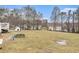 Spacious backyard with lots of lawn and trees around the property at 160 Wesley Chapel Rd, Villa Rica, GA 30180
