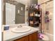 Cozy bathroom featuring a white sink and vanity, with dark painted walls and shelving at 160 Wesley Chapel Rd, Villa Rica, GA 30180