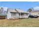 Charming single-story home featuring a covered front porch and a well-maintained lawn at 160 Wesley Chapel Rd, Villa Rica, GA 30180