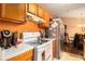 Functional kitchen featuring an electric range, stainless steel refrigerator, and wood cabinets at 160 Wesley Chapel Rd, Villa Rica, GA 30180