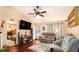 Comfortable living room showcasing hardwood floors, a ceiling fan, and access to the bedroom at 160 Wesley Chapel Rd, Villa Rica, GA 30180