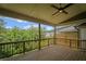 Wooden back deck overlooking a lush, green backyard with privacy fencing at 201 Retreat Ln, Canton, GA 30114