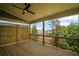 Covered wooden back deck overlooking the backyard with tree views at 201 Retreat Ln, Canton, GA 30114