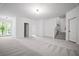 Spacious finished basement with carpeted floor and walkout access to the outdoors at 201 Retreat Ln, Canton, GA 30114