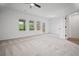 Spacious bedroom with three windows and a door to an outdoor balcony at 201 Retreat Ln, Canton, GA 30114