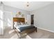 Bright bedroom with stylish decor, including a wooden bed frame and decorative wall hangings at 201 Retreat Ln, Canton, GA 30114