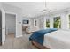 Bright bedroom featuring a seating area, large windows, and a modern chandelier at 201 Retreat Ln, Canton, GA 30114