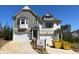 Newly built two-story home featuring a two-car garage and classic architectural details at 201 Retreat Ln, Canton, GA 30114