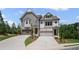 Charming two-story townhome with manicured lawn, private driveways and attached two car garage at 201 Retreat Ln, Canton, GA 30114