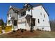 New two-story home with gray and white facade and two-car garage at 201 Retreat Ln, Canton, GA 30114