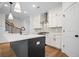 Modern kitchen features a center island, stainless steel appliances, and white cabinets at 201 Retreat Ln, Canton, GA 30114
